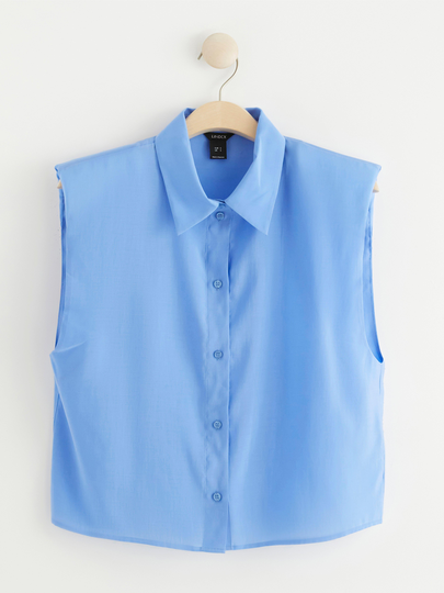 Ärmlös blus med axelvaddar